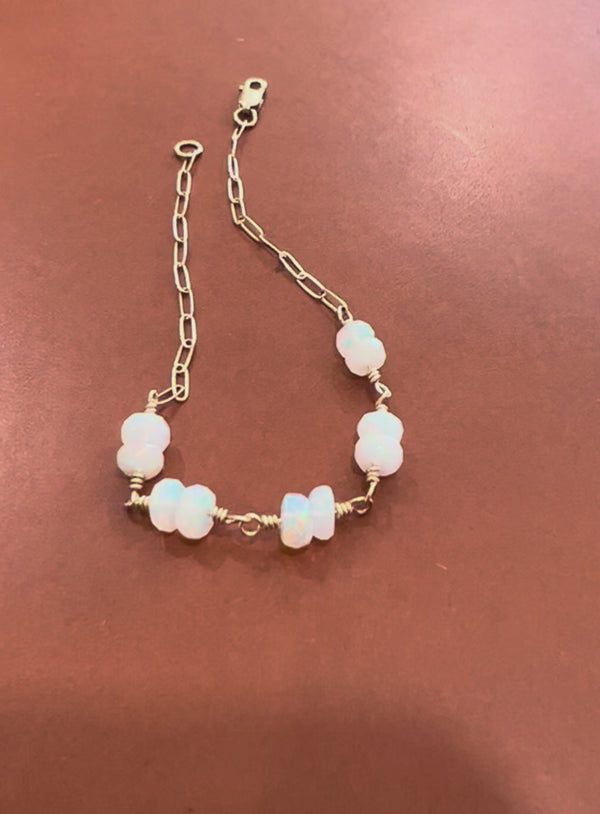 gold paperclip and opal bracelet
