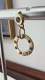 Dangle and Spin Disk Earrings with Blue Sapphire in Gold